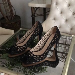 Black suede open toe pumps